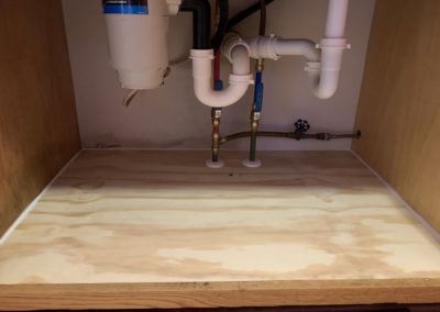fix leaking plumbing and rebuild cabinet
